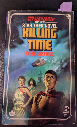 a copy of the novel with sticky notes marking some pages